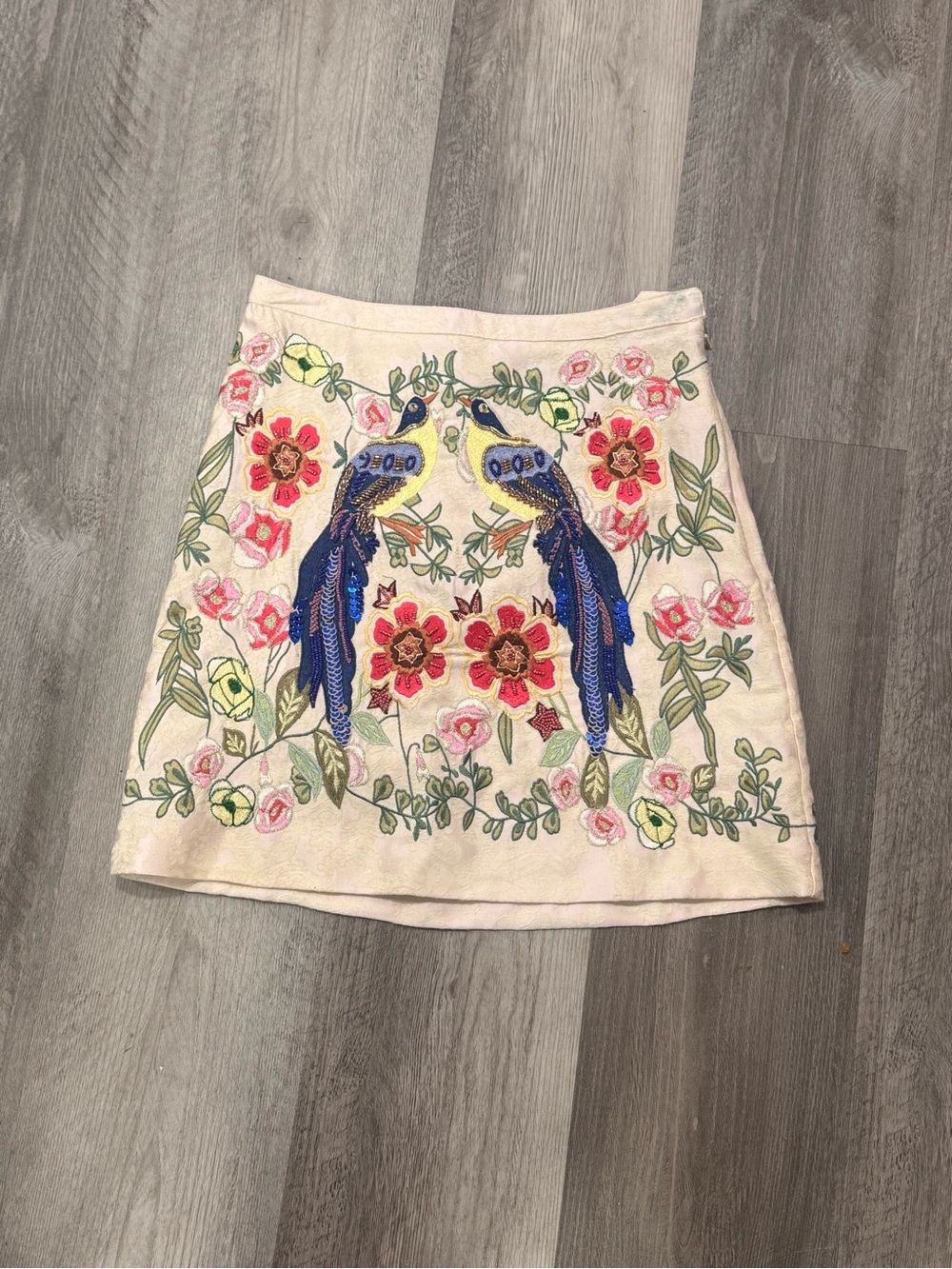 H&M Cream Mini Skirt with Blue Parrot Embroidery and Floral Motif